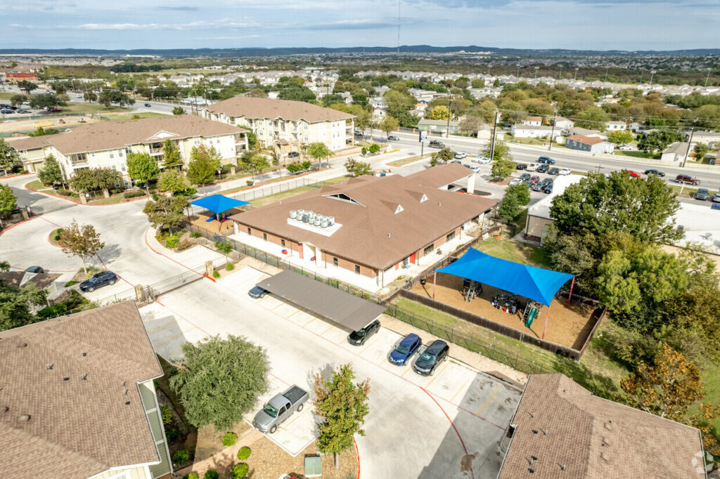 Aerial view of the commercial facility and Alamo Ranch surroundings